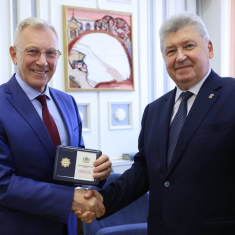 За вклад в развитие законодательства