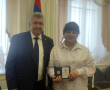За вклад в развитие законодательства